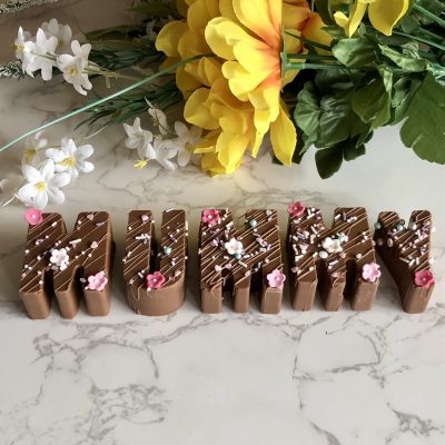 Chocolate mummy word decorated with sprinkles